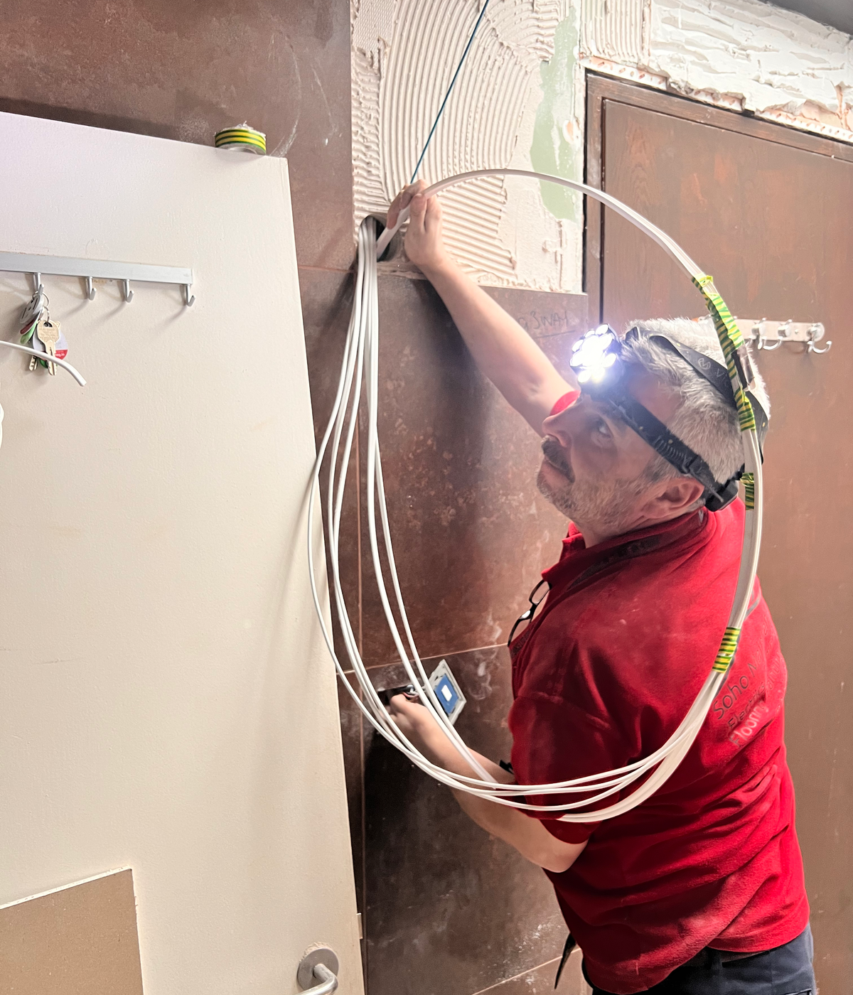 Electrician installing cables