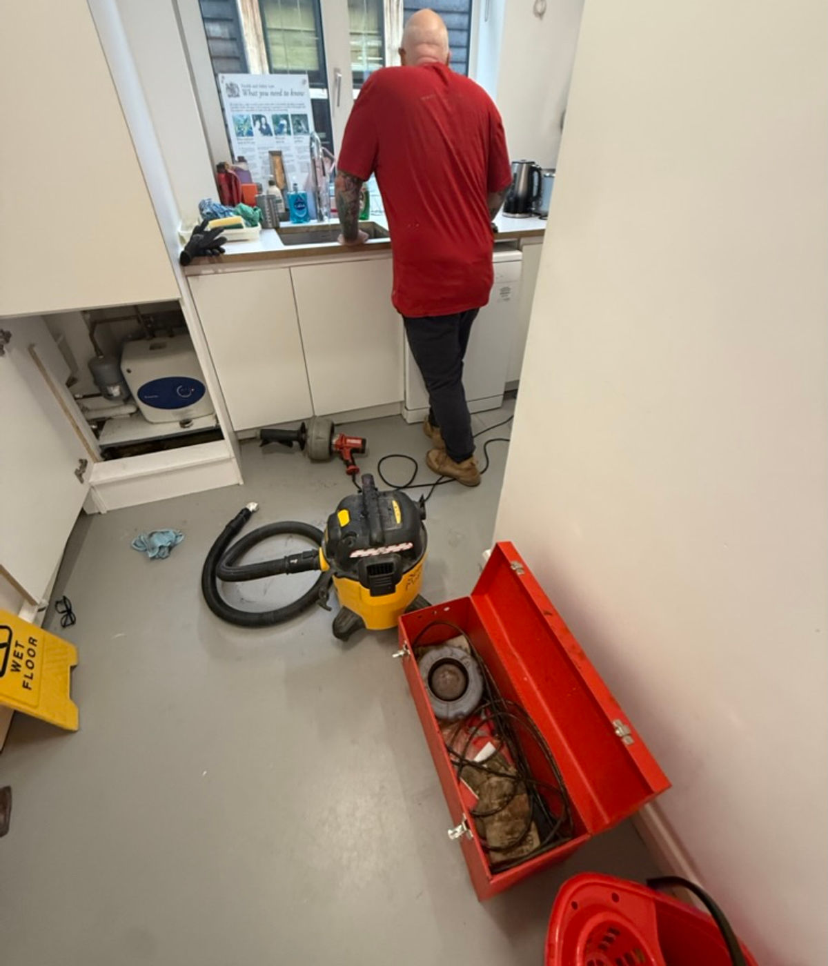 Maintenance worker fitting a kitchen